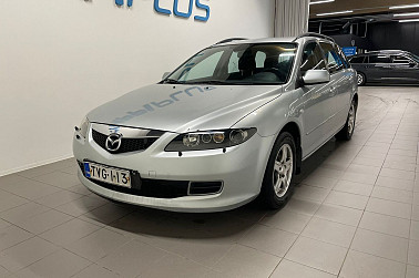 Mazda 6 Myydään huutokaupat.com kautta - Luotettava Mazda6 ketjumoottorilla, automaatti-ilmastointi ja kahdet renkaat.